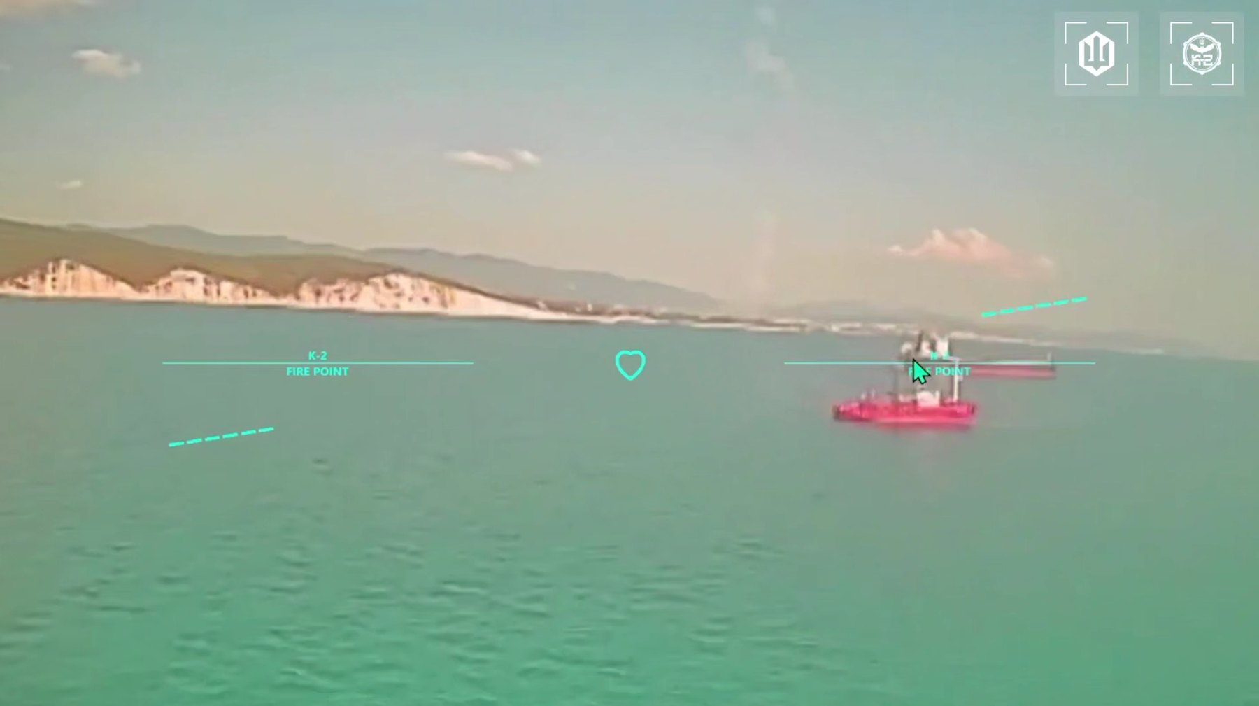 Released Ukrainian video still: a small craft marked as a fire point, coast in the background. The ship is not identified.