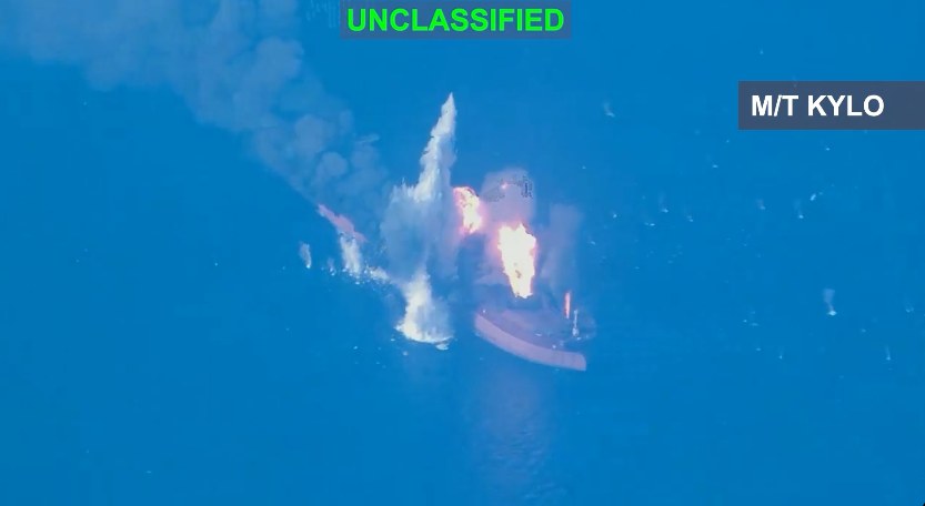 Aerial of a tanker on open water, overlay M/T KYLO.